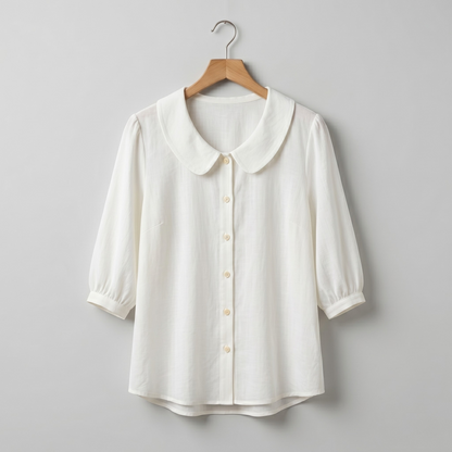 Blusa elegante de algodón ligero con cuello redondeado